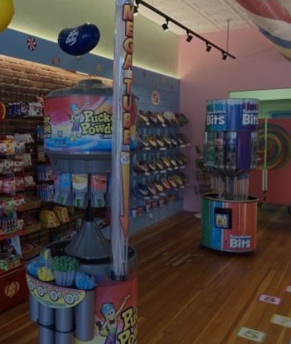 Candy store interior with product displays and colorful packaging